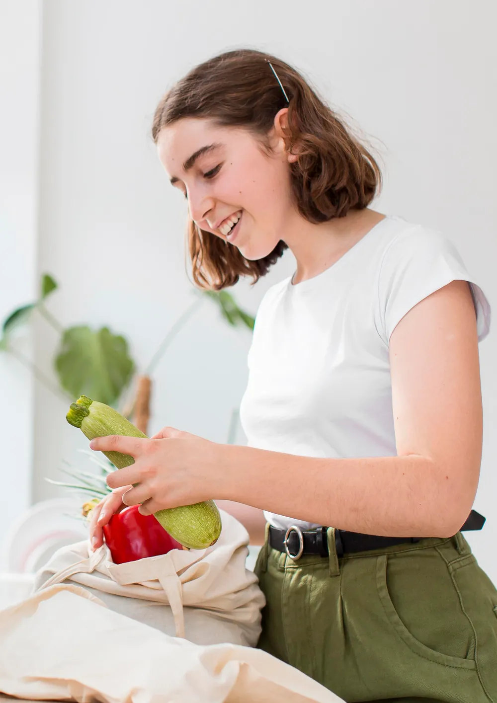 Fresh vegetables being unpacked in a kitchen